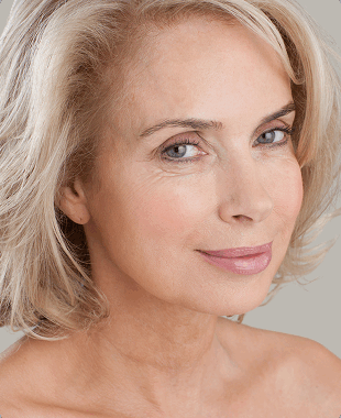 woman with grey hair and grey background